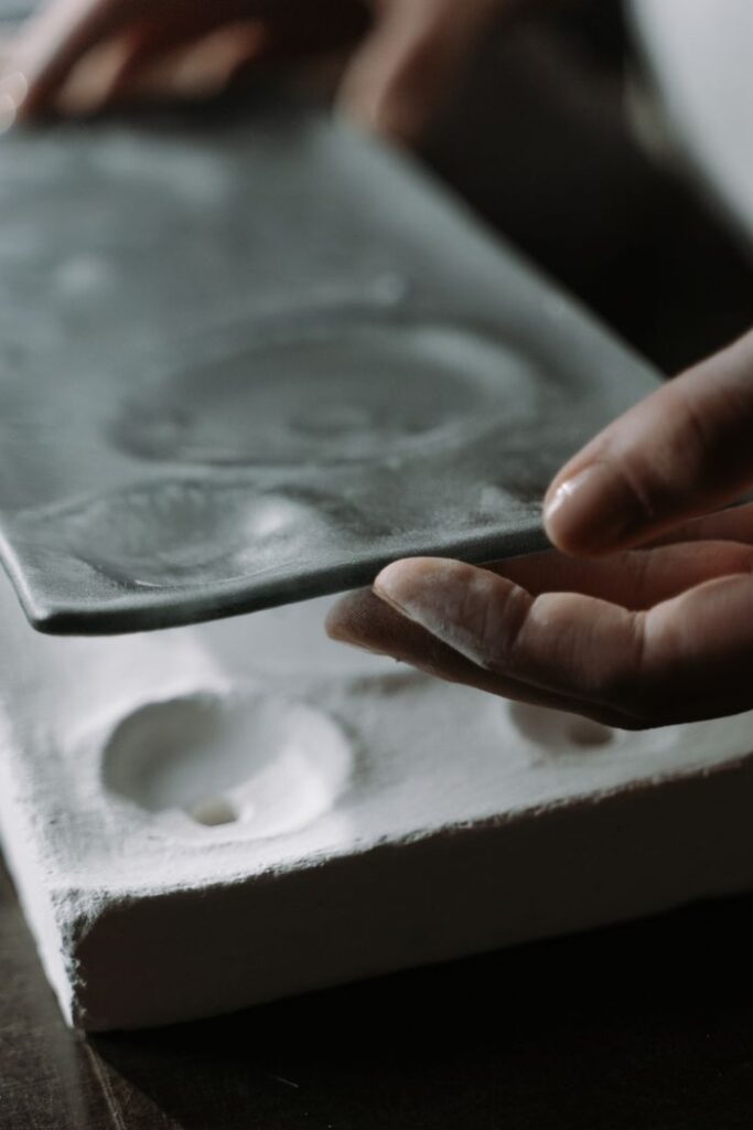 pexels-photo-7221111-7221111 Close-up of hands handling glassware showcasing craftsmanship and handcraft skills.